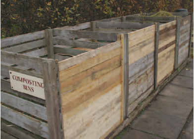 Figure 18.7 Compost bins. A typical set of bins large enough for efficient composting, slatted to allow in air and to allow easy access to add new material and to turn the contents